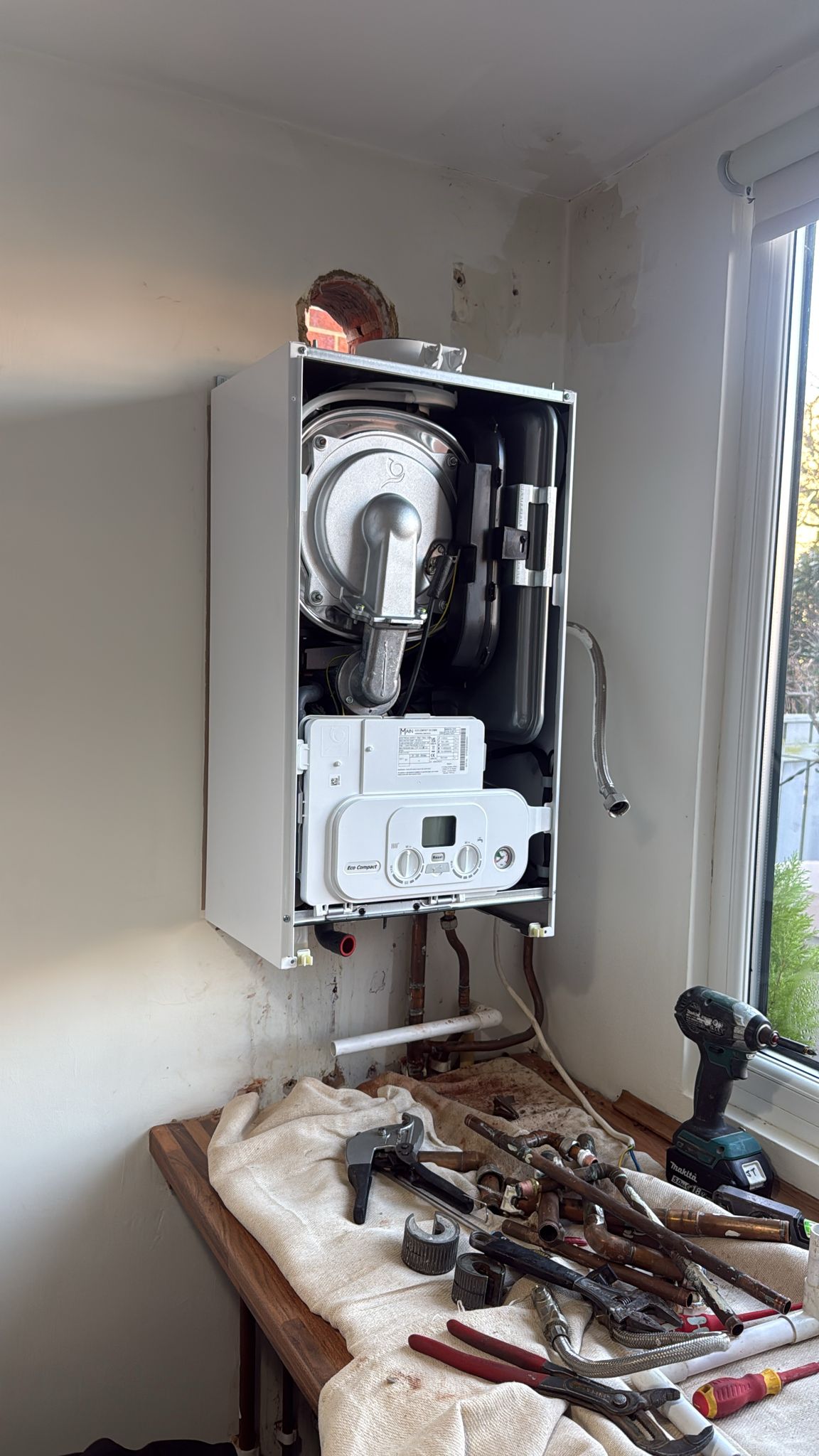 Combi boiler installation in progress, London